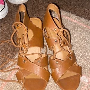 Brown wedge heel wraps around the leg  (size :9)